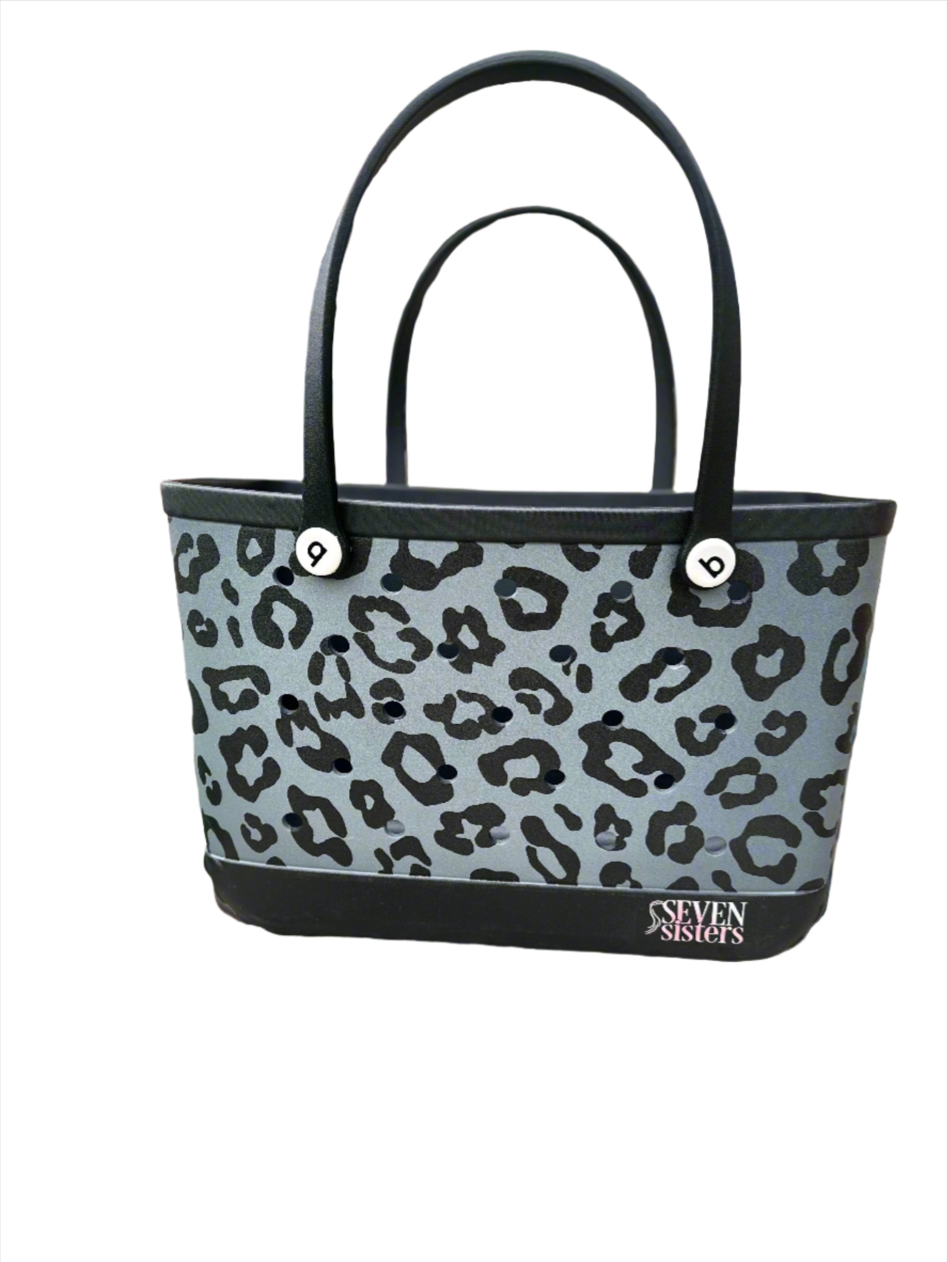 Seven Sisters - Stay stylish and organized with our Black Leopard Waterproof Silicone Tote. Perfect for the beach, pool, or any on-the-go activity. Durable and versatile, this tote is a must-have accessory for all your essentials. Order yours today!
