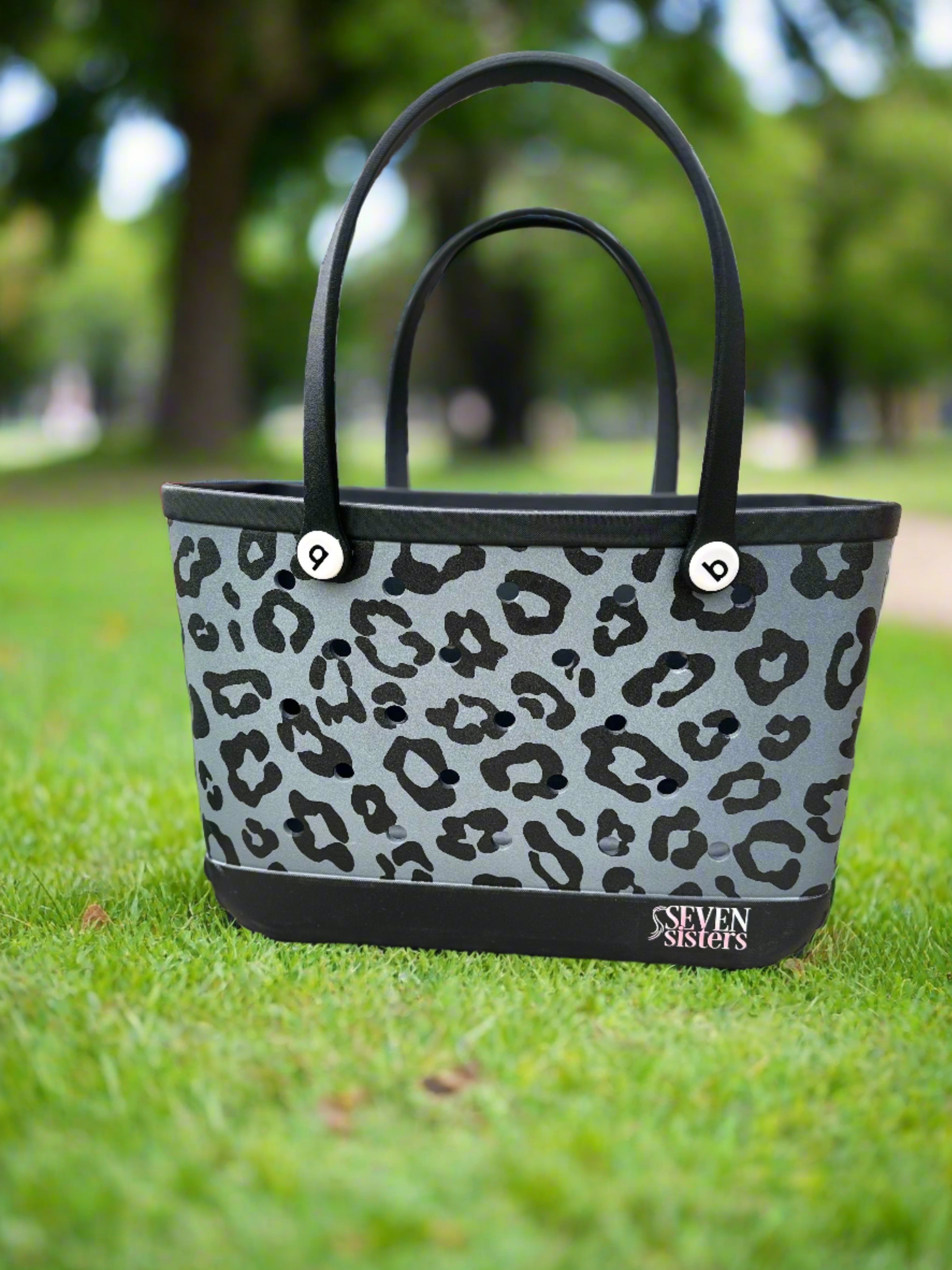 Seven Sisters - Stay stylish and organized with our Black Leopard Waterproof Silicone Tote. Perfect for the beach, pool, or any on-the-go activity. Durable and versatile, this tote is a must-have accessory for all your essentials. Order yours today!